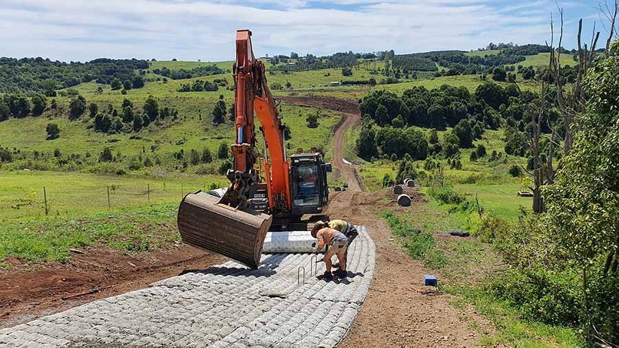 Erosion control and slope protection using concrete mats